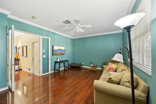 living area featuring dark wood-type flooring, ceiling fan, and ornamental molding