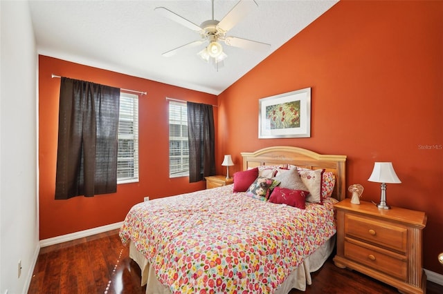 bedroom featuring ceiling fan, dark hardwood / wood-style flooring, and vaulted ceiling