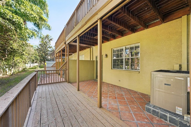 wooden terrace featuring a patio