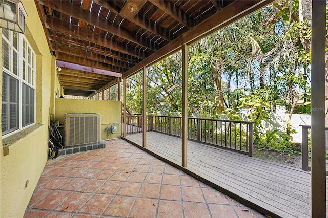 view of patio / terrace with a wooden deck and central air condition unit