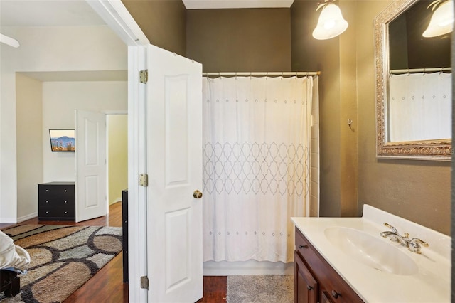 bathroom with shower / tub combo with curtain and vanity