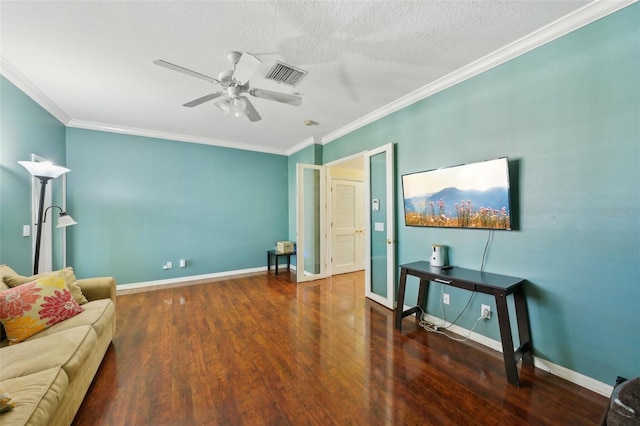 living room with ornamental molding, dark hardwood / wood-style floors, a textured ceiling, and ceiling fan