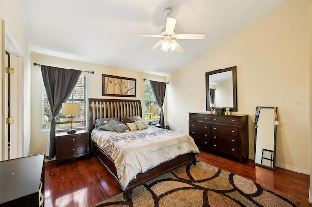 bedroom featuring ceiling fan, dark hardwood / wood-style floors, and vaulted ceiling