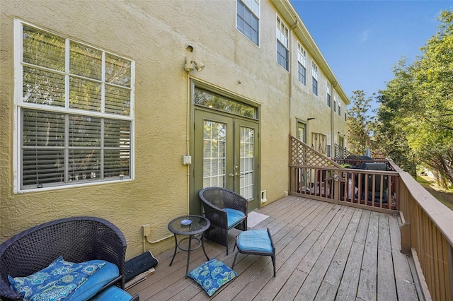 wooden deck featuring french doors