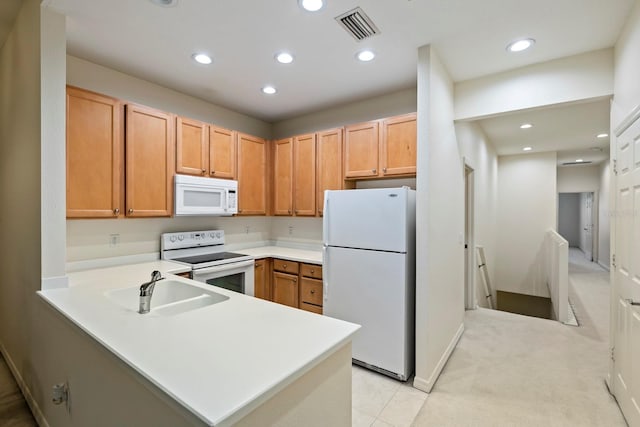 kitchen with light colored carpet, sink, kitchen peninsula, and white appliances