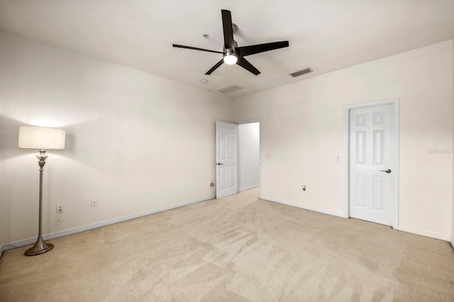 unfurnished bedroom featuring ceiling fan and light colored carpet