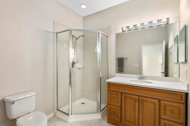 bathroom with vanity, tile patterned flooring, toilet, and a shower with shower door