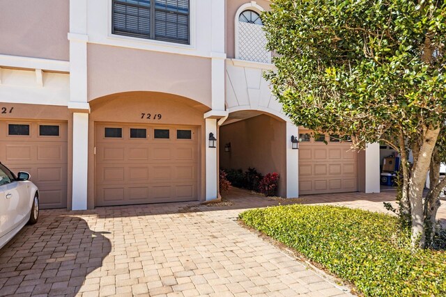7219 Hamilton Rd Unit 7219, Bradenton, FL 34209 - exterior space featuring stucco siding, an attached garage, and decorative driveway