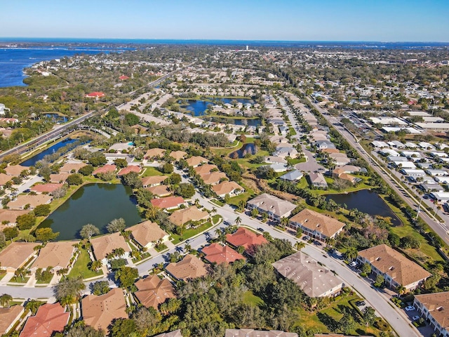 drone / aerial view with a water view