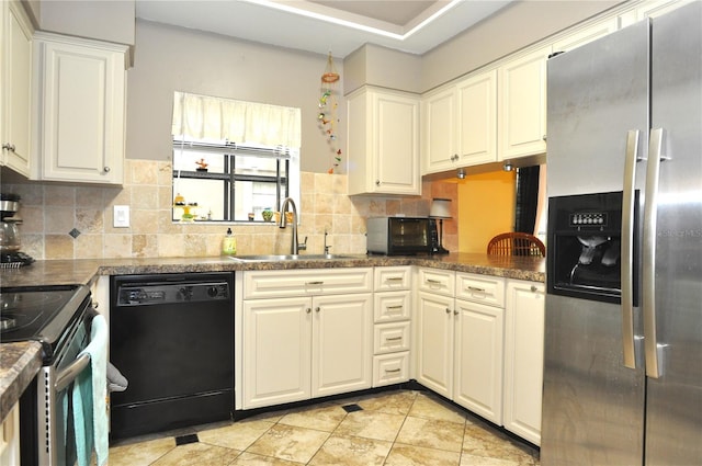 kitchen featuring backsplash, white cabinetry, sink, and stainless steel appliances