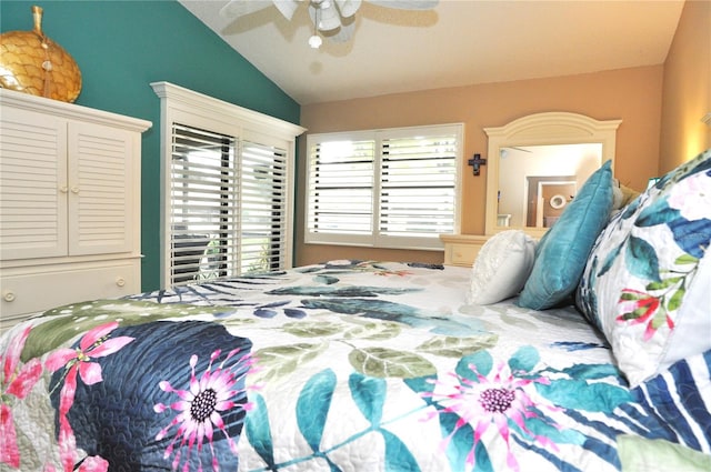 bedroom with ceiling fan and vaulted ceiling