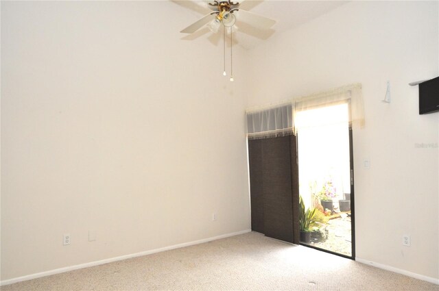 spare room with light carpet and ceiling fan