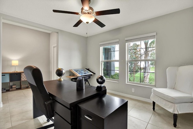 office space with ceiling fan and light tile patterned flooring