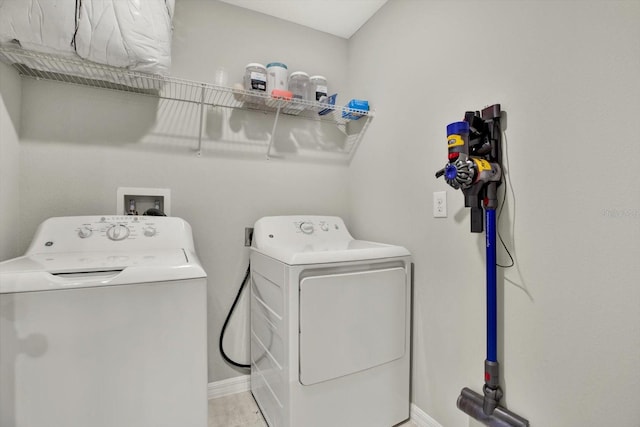 clothes washing area with washer and dryer