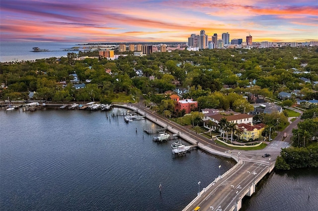 aerial view at dusk with a water view