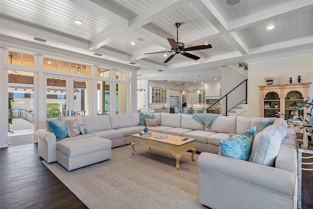 living room featuring beam ceiling, ceiling fan, coffered ceiling, and hardwood / wood-style floors