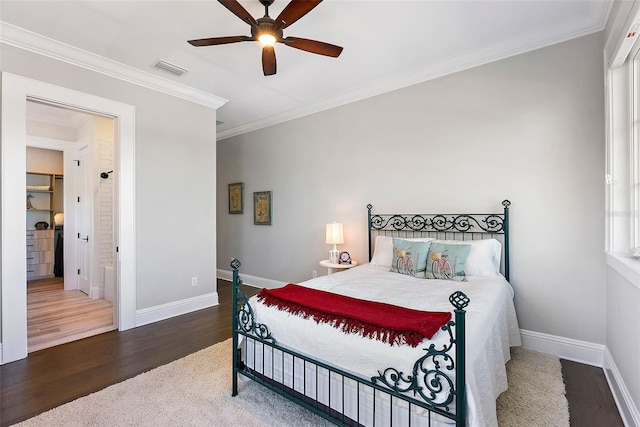 bedroom with ceiling fan, crown molding, and hardwood / wood-style floors