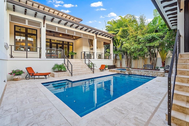 view of pool featuring an in ground hot tub and a patio area