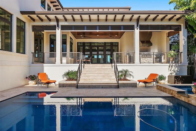 back of property featuring a patio and ceiling fan