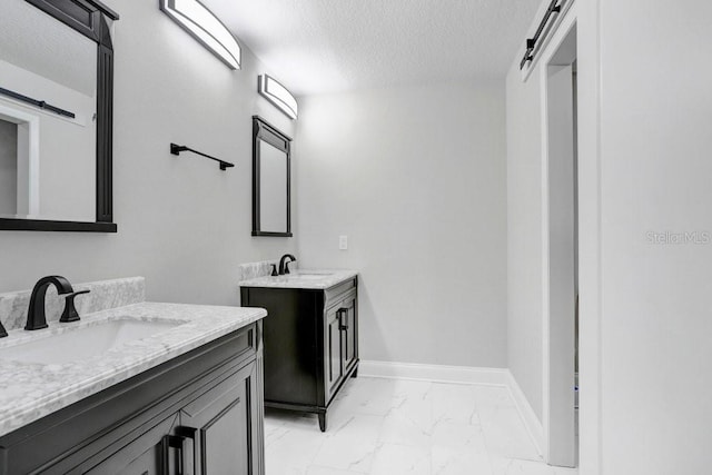 bathroom featuring vanity and a textured ceiling