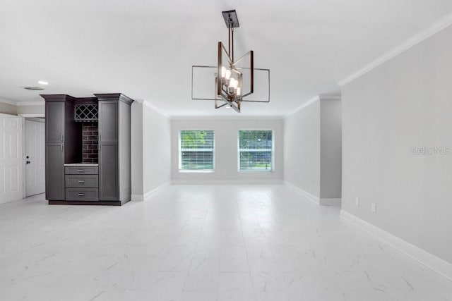 unfurnished living room featuring ornamental molding and a chandelier