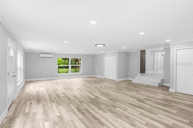 unfurnished living room with light hardwood / wood-style flooring, an AC wall unit, and crown molding