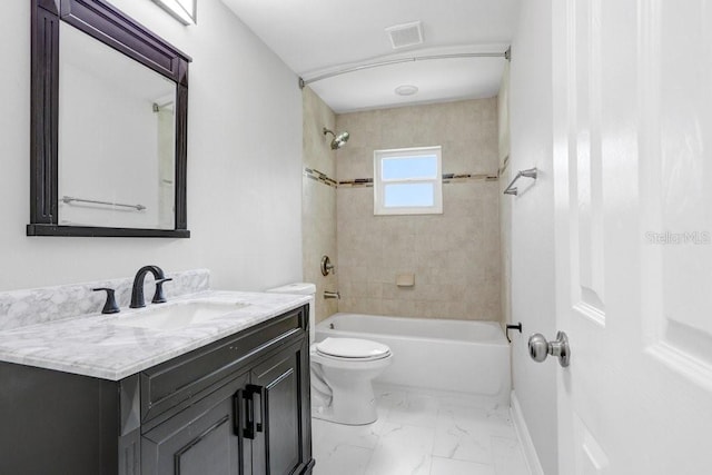 full bathroom with toilet, tiled shower / bath combo, and vanity