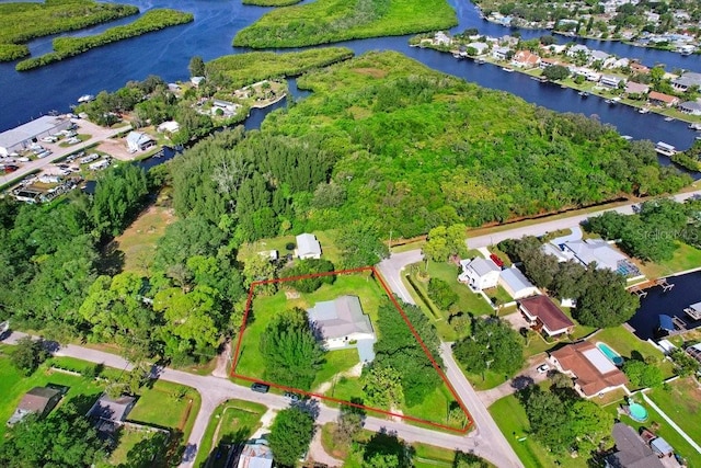 birds eye view of property featuring a water view