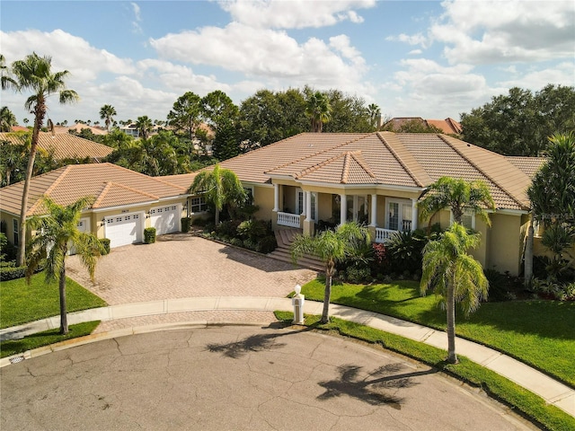 view of front of home featuring a garage and a front lawn