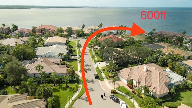 birds eye view of property with a water view