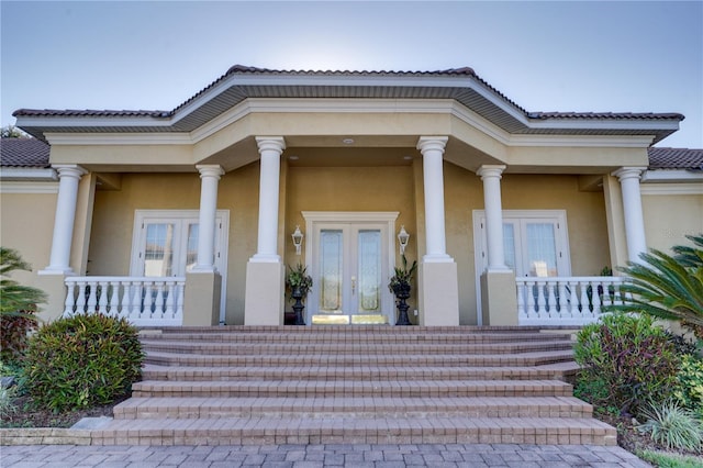 doorway to property featuring french doors