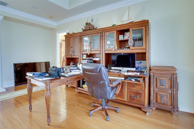 office area with ornamental molding and light hardwood / wood-style flooring