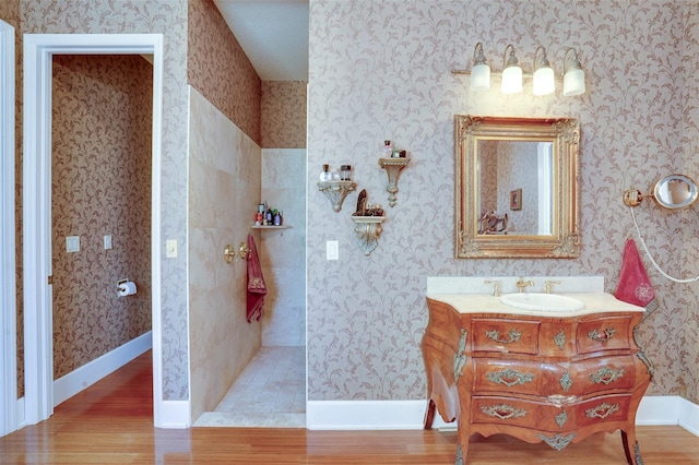 bathroom with vanity and hardwood / wood-style floors