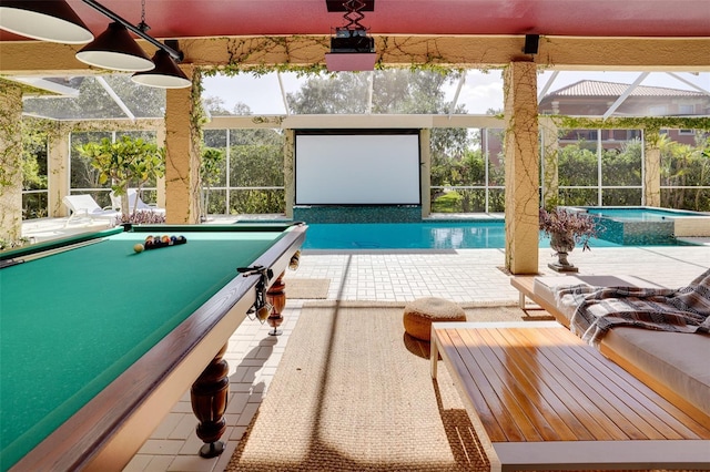 view of pool with an in ground hot tub, glass enclosure, and a patio area