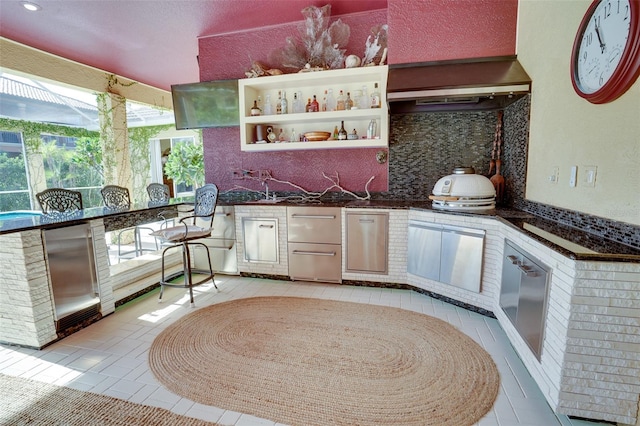 view of patio featuring an outdoor kitchen