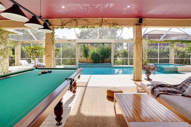 view of swimming pool featuring an in ground hot tub, a lanai, and a patio