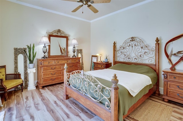 bedroom featuring ceiling fan, ornamental molding, and light wood-type flooring