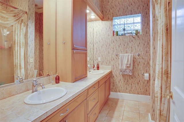 bathroom with tile patterned flooring and vanity