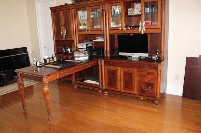 home office with light wood-type flooring