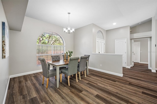 dining space featuring an inviting chandelier and dark hardwood / wood-style floors