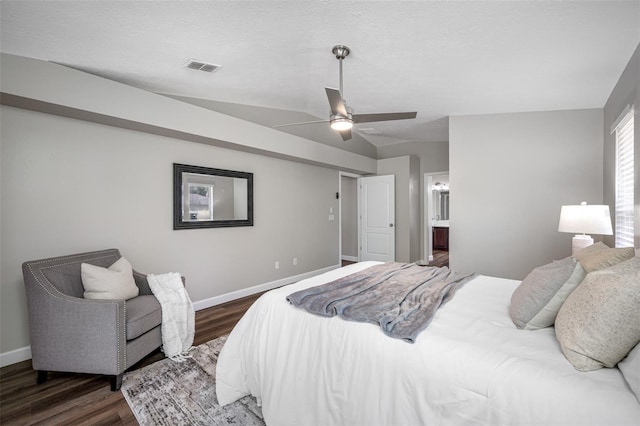 bedroom featuring dark wood-type flooring, vaulted ceiling, and ceiling fan