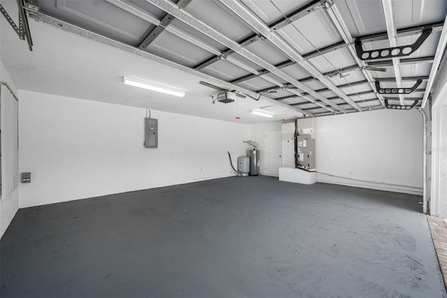 garage with a garage door opener, electric panel, and electric water heater