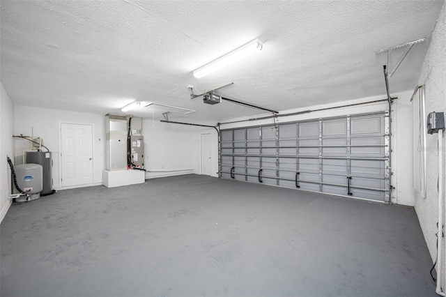 garage featuring a garage door opener, water heater, and heating unit