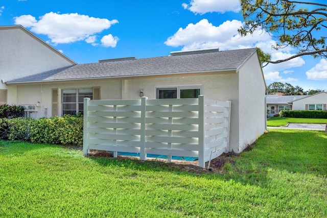 view of home's exterior featuring a lawn