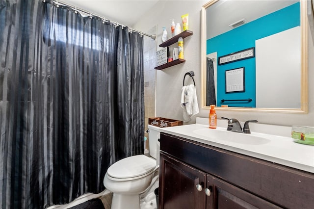 bathroom with vanity, toilet, and a shower with shower curtain