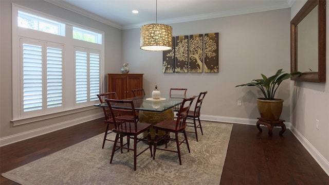 dining room featuring crown molding and dark hardwood / wood-style flooring