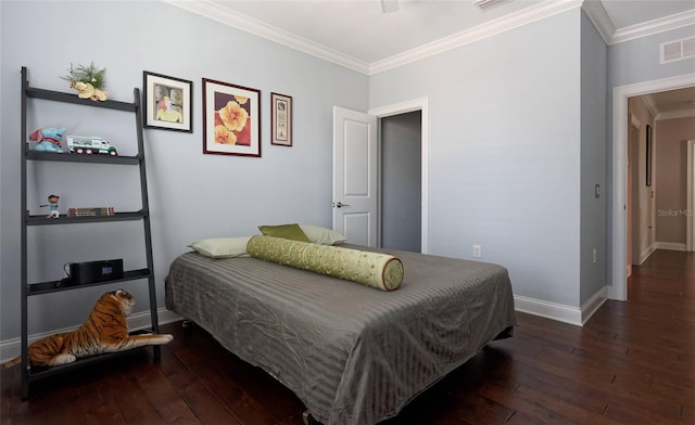 bedroom featuring ornamental molding and dark hardwood / wood-style flooring