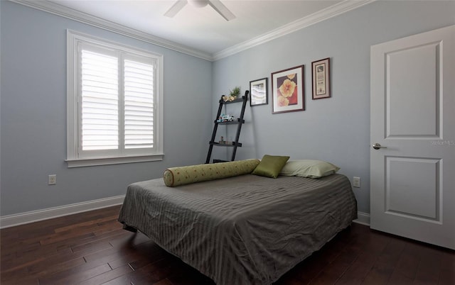 bedroom with crown molding, dark hardwood / wood-style floors, and ceiling fan