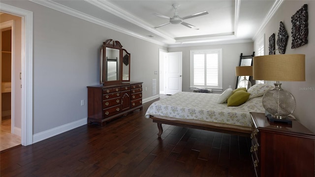 bedroom with ceiling fan, ornamental molding, a raised ceiling, and dark wood-type flooring