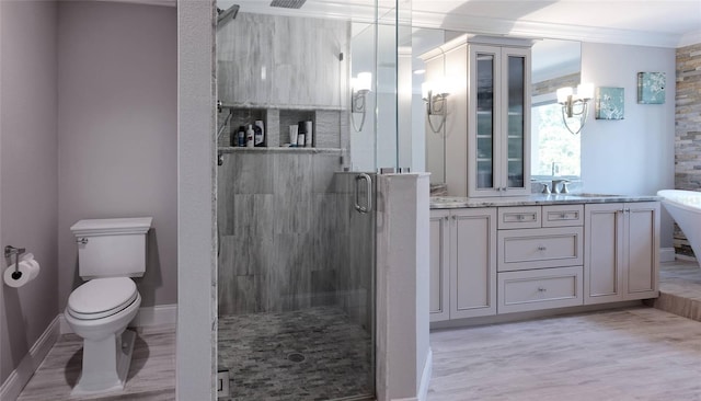 bathroom featuring vanity, toilet, ornamental molding, an enclosed shower, and hardwood / wood-style floors